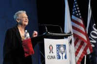 Harriet May welcomes more than 2,800 attendees during the Opening Ceremony of the The 1 CU Conference.