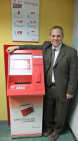 Steve Schaefer with one of the new ATMs at Santa Maria Magdalena Credit Union.