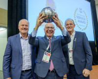 Arnaldo Jardim (Brazil) hoists his 2024 Distinguished Service Award