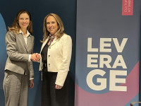 Elissa McCarter LaBorde shakes hands with Marisela Alvarenga, Chief Investment Officer at IDB Invest